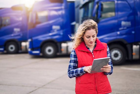 Woman in front of semi truck