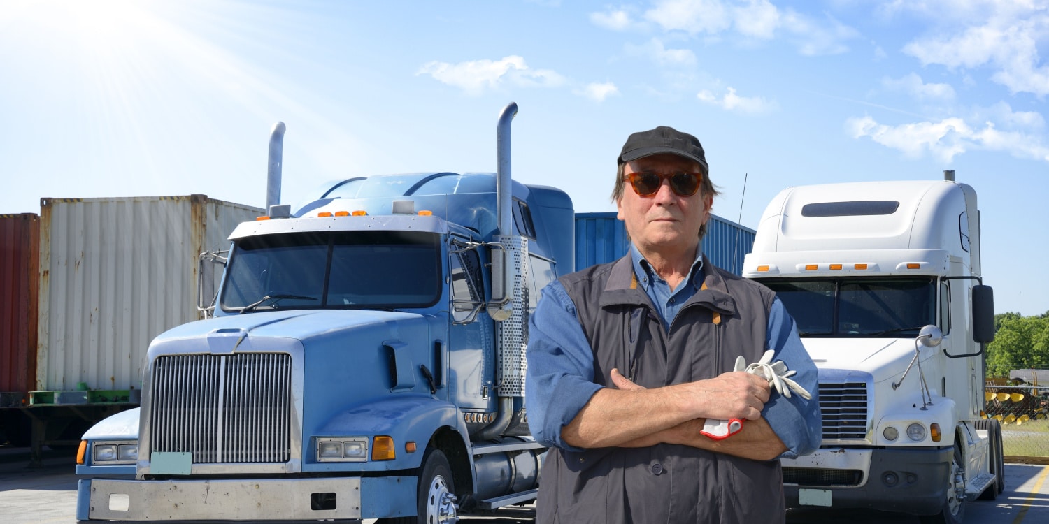 Man standing in front of a truck.